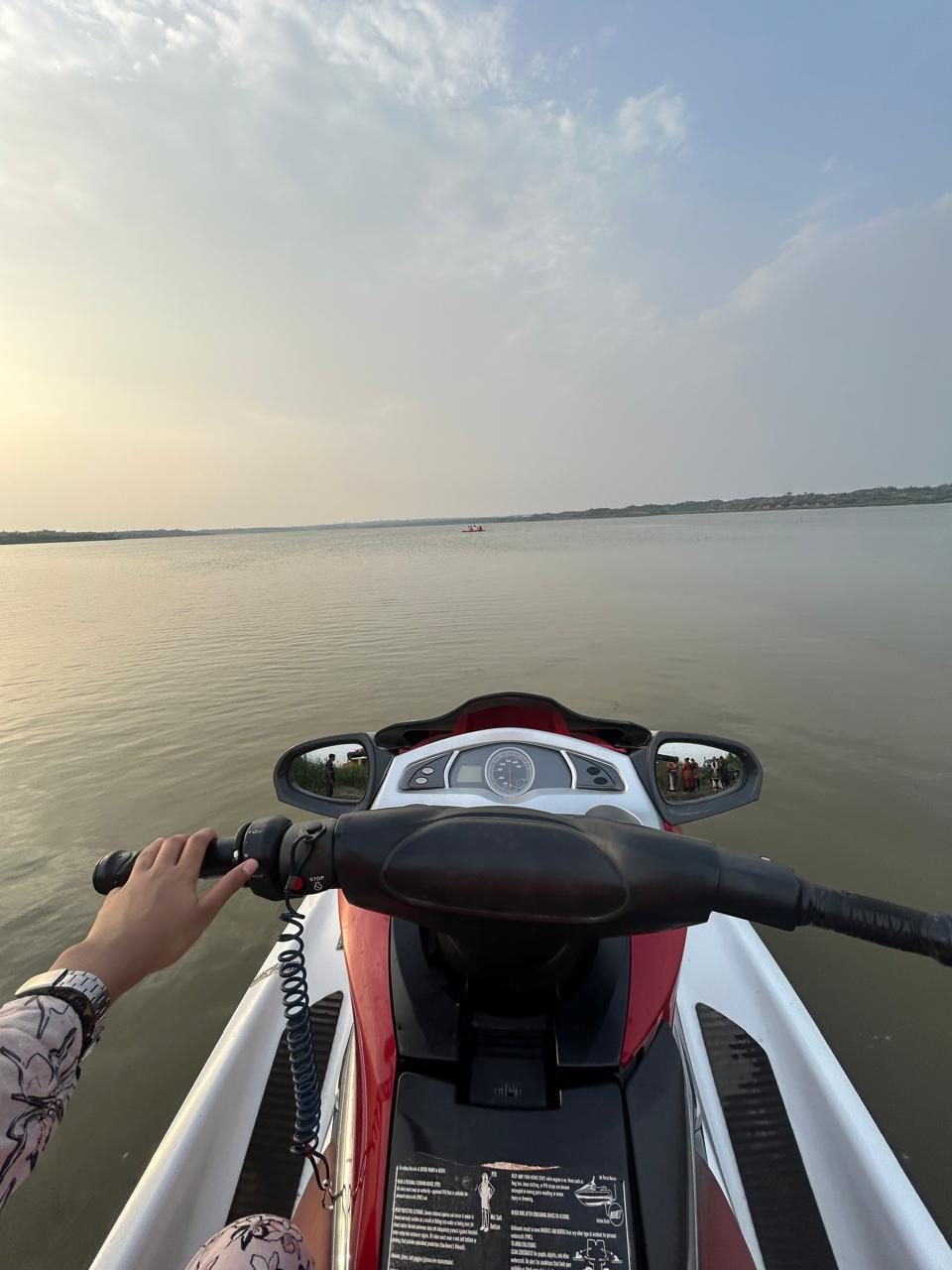 View from a jet ski at sunset